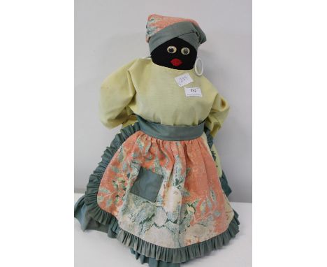 A vintage doll with weighted base. 49cm tall. 