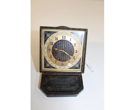 A vintage enamel face travel clock 