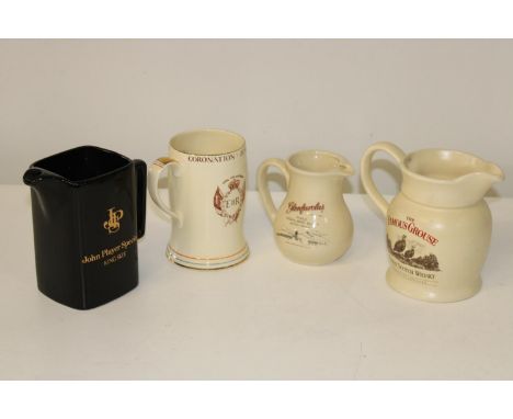Four vintage advertising jugs 