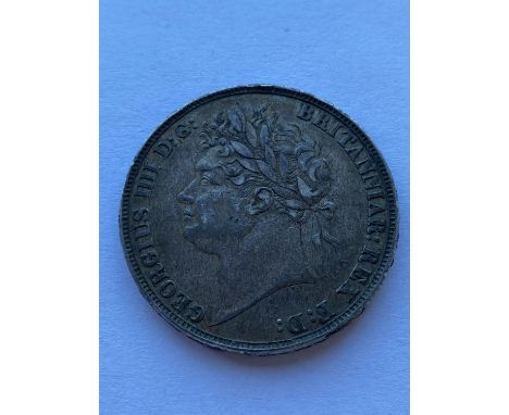 A George IV Crown. laureate bust l, reverse, George and the Dragon, dated 1821. Regnal year to the rim Tertio   *Condition:  