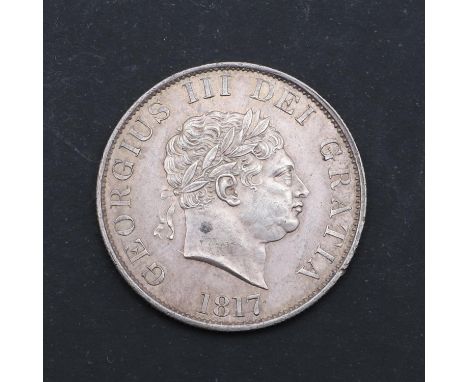 A George III Halfcrown, smaller laureate head r. with date 1817, reverse with crowned garter and shield   *Condition:  Slight