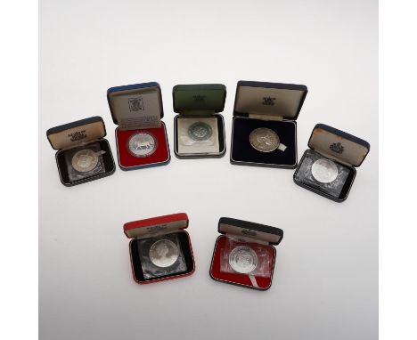 A Royal Mint silver medal commemorating Prince Charles' Investiture 1969. A Royal Mint 1977 Silver Proof Crown, 1977. A Royal