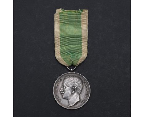 A Messina Earthquake Medal 1908, on green and white ribbon. This medal was awarded by the Ling of Italy to the Royal Navy and