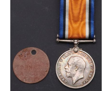 A Great War  Medal named to F.29106 V.G. Cornall A.C. 1. RNAS. And a single dog tag. Victor George Cornall was born in Exeter