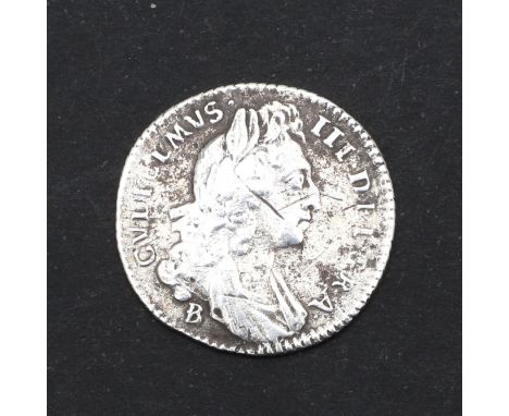 A William III sixpence, first draped bust r. with B over E below the bust for the Bristol Mint. Reverse crowned cruciform shi