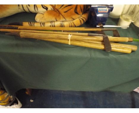 Three Hickory Shafted Golf Clubs, Cricket Stumps and A Bow. 