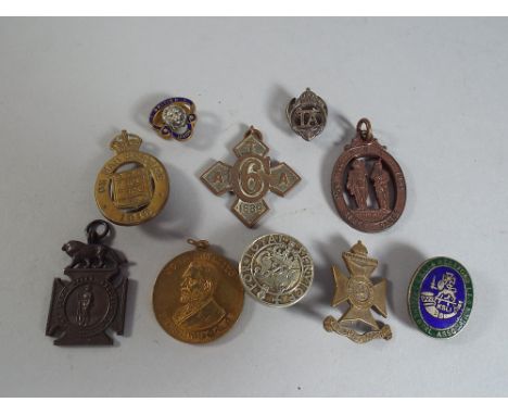 Ten Military Items to include-An Army Temperance Association Six Years Medal, An Army Rifle Club Medal, Rifles Lapel Badge (S