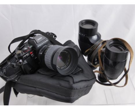 A Pentax Program A made in Japan Camera, with instruction booklet and four extra lenses, one a Sigma 75 mm - 210 mm, a Pentax