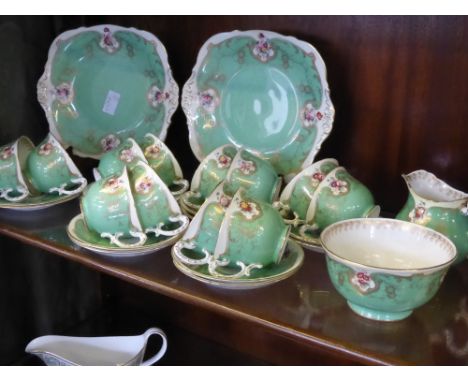 Quantity of 'Royal Worcester', including two sandwich plates, twelve cups and saucers, milk jug, sugar bowl, seven side plate