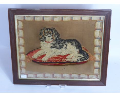 An Antique Tapestry depicting a King Charles Spaniel, approx 54 x 44 cms.
