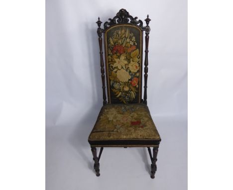 A Cloister Chair, tapestry back and seat, turned legs with stretchers.