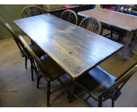 A Stagg Kitchen Table approx 150 x 56 cms with six matching wheelback chairs.