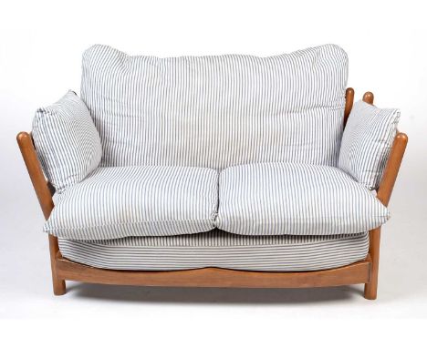 Attributed to Ercol: a modern beech wood two-seater sofa with striped cotton upholstery, 134 x 70cms high.