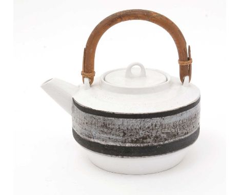 A Troika Teapot and cover decorated by Stella Benjamin, circa 1963-67, cream ground with grey textured band, bamboo handle, s