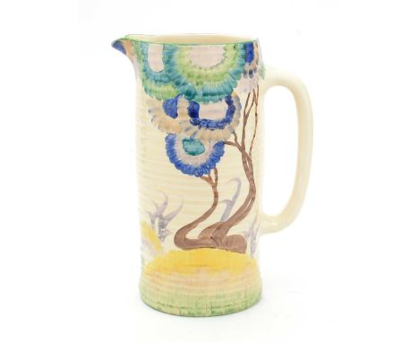 A Clarice Cliff Aurea pattern ribbed cylindrical jug, with stylised growing flowers in blue, green, yellow and brown colours,