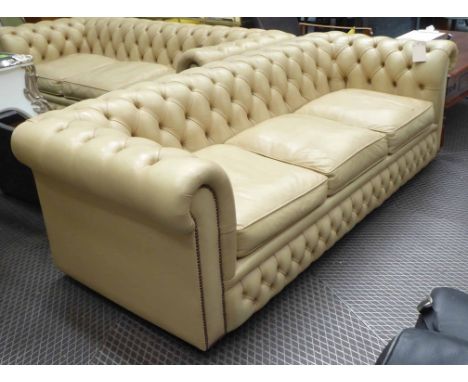 CHESTERFIELD SOFA, contemporary, cream leather buttoned and studded castors, 211cm L (with slight fault).