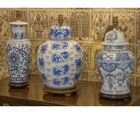 LAMPS, three Chinese ceramic blue and white pattern, including two ginger jar shaped and one vase shaped, with shades - talle