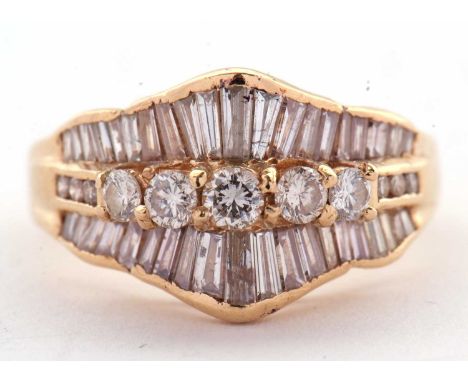 A diamond ring, set to centre with five round brilliant cut diamonds and three smaller round brilliant cut diamonds to either