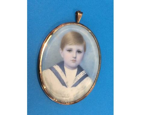 A miniature portrait of a boy, in yellow metal frame