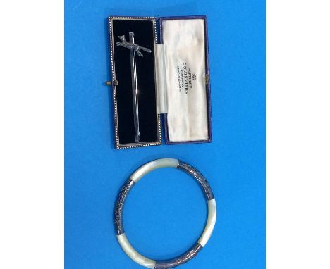 A sterling brooch and a mother of pearl bangle