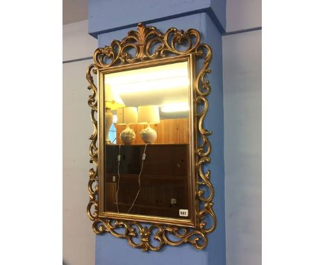 A gilt mirror and console table