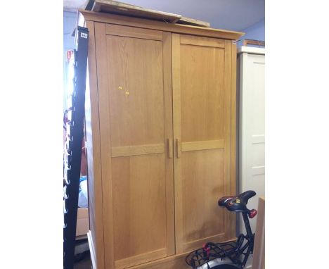 An oak Barker and Stonehouse two door wardrobe with single drawers