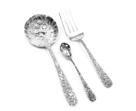A sterling silver meat fork, by S Kirk &amp; Son Inc, the handle embossed with flowers, together with a fruit spoon, the bowl