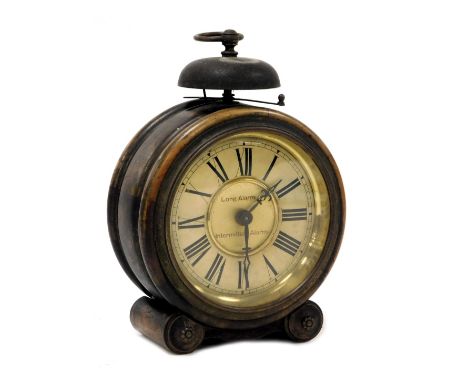 An early 20thC Wurttemberg beech cased alarm clock, circular brass dial, with chapter ring bearing Roman numerals, clockwork 