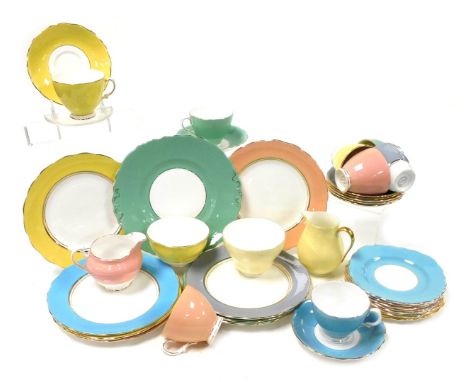 A Colclough porcelain harlequin part tea service, comprising cream jug, sugar bowl, bread plate, eight teacups, saucers and p