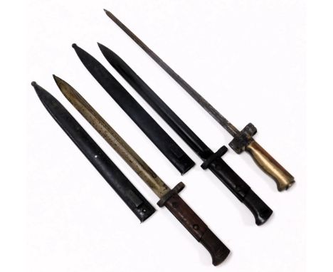 Two WWI period bayonets, with metal scabbards, and a French Lebel bayonet, model 1886-15. (3)