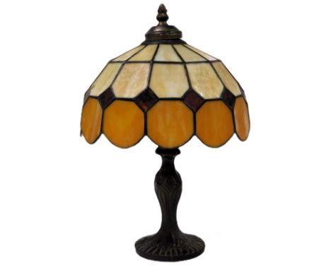 A Tiffany style table lamp, with an orange and opaline faceted shade, 38.5cm high.