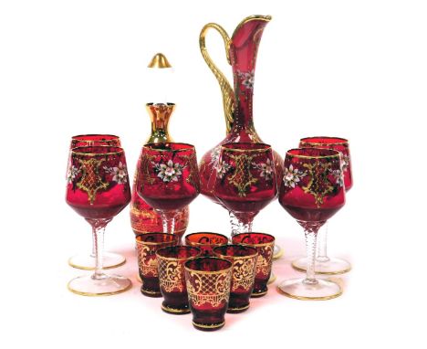 A Venetian ruby glass liqueur set, gilt decorated with views of Venice, comprising a decanter 27cm high, and six glasses, tog