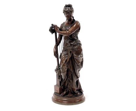 After Auguste Moreau (French, 1834-1917). Bouret, bronze of a standing lady, beside a harp, on a plinth, raised on a circular