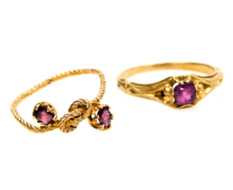 Two 19thC amethyst set rings, in yellow metal, one with a tied rope twist design, with amethyst set terminals, approximate si