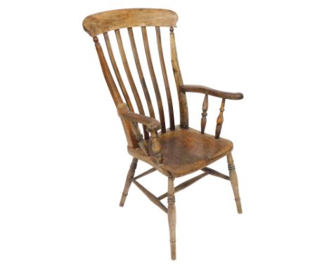 A Victorian oak and elm ladder back kitchen chair, with a solid saddle seat, raised on a h frame stretcher, 61cm wide.