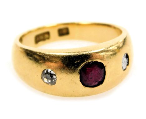 A ruby and diamond three stone gypsy ring, one diamond lacking, set in yellow  metal, stamped 18ct, size I, 7.1g.