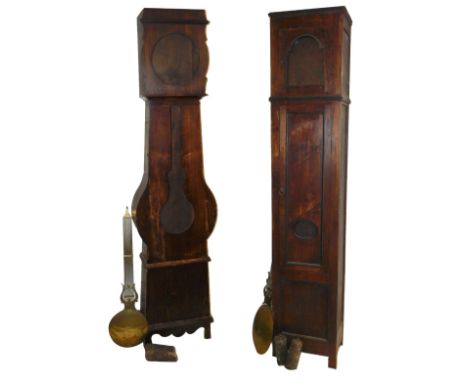 Two 19thC French pine longcase clock cases, with pendulums, 231cm and 218cm high respectively.