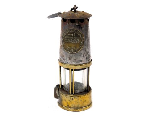 A Ministry of Power type 6 brass and tin miner's lamp, by the Protector Lamp &amp; Lighting Company Ltd, Eccles, 23cm high.