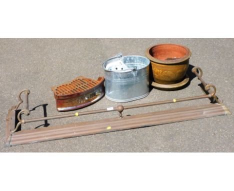 A Victorian brass fender, 142cm wide, a mid century fire grate, galvanised bucket, and a garden pot on stand. (4)