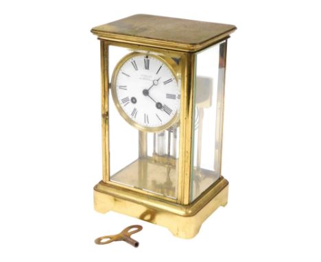 A late 19thC French brass cased mantel clock, circular enamel dial bearing Roman numerals, eight day movement by A D Mougin, 