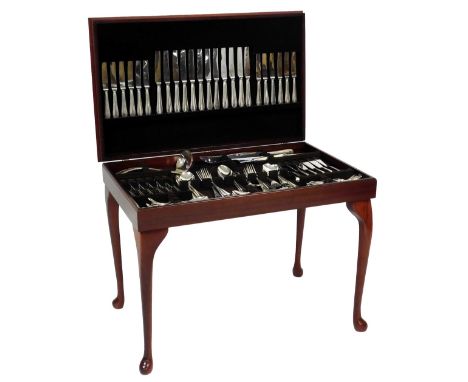 A table canteen of silver plated Bead pattern cutlery, twelve place settings, with soup ladle and carving set, within a gilt 
