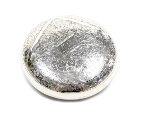 A George V silver decorative compact, sprung hinged lid with floral engraving, John William Caldecott, Birmingham 1910, 7cm d