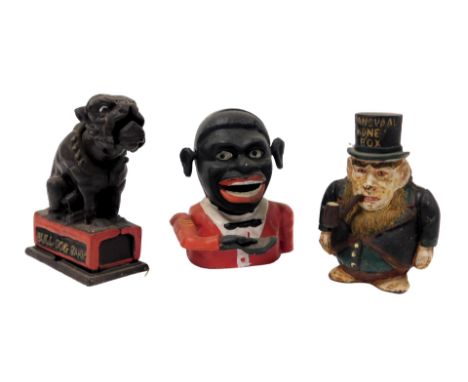 Three novelty replica cast iron money boxes, comprising Bulldog Bank, Jolly Fella and Transvaal. Notice from the the-saleroom