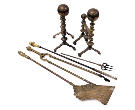 A group of Victorian brass fire irons, comprising a shovel, pair of coal tongs and a poker, together with a toasting fork, an