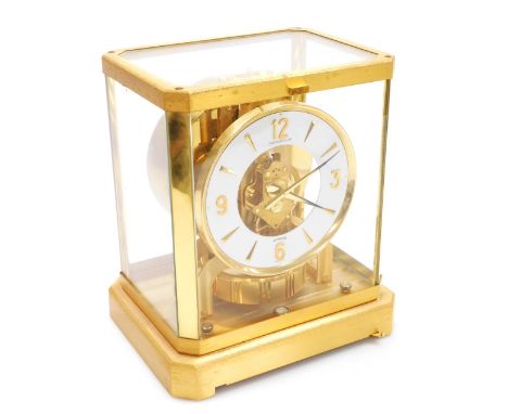 A late 20thC Jaeger-le-Coultre Atmos table clock, the brass dial with white chapter ring bearing Arabic numerals at quarters,