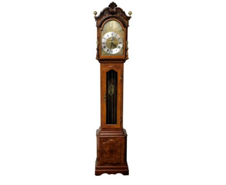 A walnut and mahogany longcase clock, by Christiaan Huygens, the break arch dial decorated with a 19thC street scene, silvere