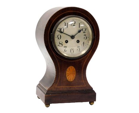 An Edwardian mahogany balloon mantel clock, circular silvered dial bearing Arabic numerals, eight day movement with coil stri