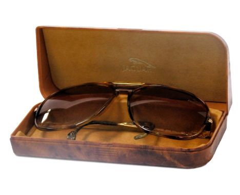 A pair of vintage Jaguar sunglasses, cased.