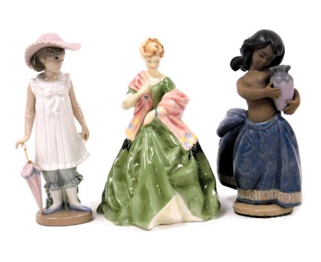 A Royal Worcester porcelain figure modelled as First Dance, 3629, A Nao porcelain figure of a girl, modelled standing with a 