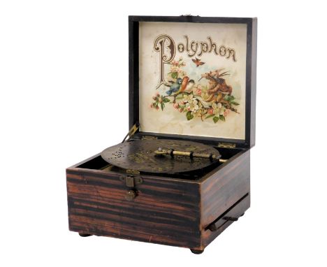 A Victorian boxed polyphon with single disc, in a faux rosewood and floral printed box, 20cm wide.